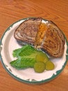 High angle shot of sandwich bread with sliced pickles and lettuce Royalty Free Stock Photo