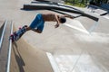 High angle shot of a skateboarder doing tricks on his skateboard during a sunny day Royalty Free Stock Photo