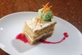 High angle shot of a slice of carrot cake and a scoop of pistachio ice cream on a white plate Royalty Free Stock Photo