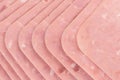 High angle shot of slices of pork lunchmeat lined up in a neat way Royalty Free Stock Photo