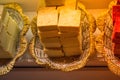 High angle shot of a stack of yellow square soaps at a market