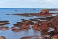 High angle shot of stone formations on the shore of North Berwick, Scotland, UK