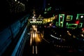 High-angle shot of the streets of Bangkok illuminated with neon lights at night