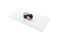 High angle shot of two philadelphia sushi rolls on a white tray isolated on a white background Royalty Free Stock Photo