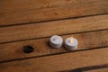 High angle shot of two small electric candles on a wooden surface Royalty Free Stock Photo