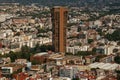 High-angle shot of an urban area with a single tall building during the day