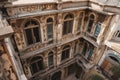 high-angle shot of vintage building with intricate stone details, windows, and other architectural elements visible