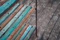 High angle shot of a wooden rusty outdoor shelf on a wooden floor