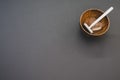 High angle shot of a wooden shaving water bowl near a shaving razor isolated on a grey background Royalty Free Stock Photo