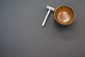 High angle shot of a wooden shaving water bowl near a shaving razor isolated on a grey background Royalty Free Stock Photo