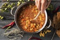 Man preparing a vegetarian lentil stew