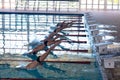 Swimmers plunging in the pool Royalty Free Stock Photo