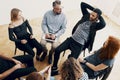 High angle of spanish teenager talking with therapist during meeting of support group Royalty Free Stock Photo