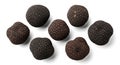Seven luxurious black truffles isolated on white Royalty Free Stock Photo
