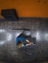 High angle top-down view of a man shooting a handgun at an indoor firing range with multiple rifles visible Royalty Free Stock Photo