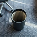 Empty Office Wastebasket on Patterned Carpet Royalty Free Stock Photo