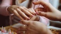 High angle of unrecognizable female applying nail polish on fingernails of client during manicure in beauty studio. Generative AI