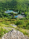 High angle view from altitude to the Saharna Monastery, Moldova. Idyllic place with the church in the middle of woods on the gorge