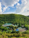 High angle view from altitude to the Saharna Monastery, Moldova. Idyllic place with the church in the middle of woods on the gorge