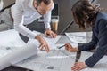 high angle view of architects working with building plans together Royalty Free Stock Photo