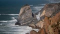 Bare cliffs with dramatic waves in sea