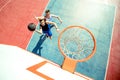 High angle view of basketball player dunking basketball in hoop Royalty Free Stock Photo