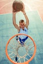 High angle view of basketball player dunking basketball in hoop Royalty Free Stock Photo