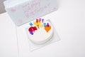 High angle view of birthday cake and gift on table Royalty Free Stock Photo