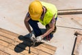 High-angle view of a blue-collar worker using a hammer Royalty Free Stock Photo