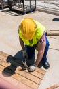 High-angle view of a blue-collar worker using a hammer Royalty Free Stock Photo