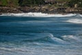 High-angle view of Bondi Beach surfers sitting out the back of the surf waiting for a wave to catch