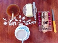 High angle view of breakfast ingredients butter, jam and toasted bread