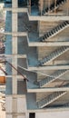 High angle view of a building under construction with unfinished concrete staircases and construction site safety net