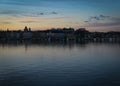 High angle view of buildings by river against sky at sunset Royalty Free Stock Photo