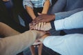 High angle view of business colleagues stacking hands Royalty Free Stock Photo