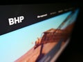 High angle view of business website with logo of mining, metals and petroleum company BHP Group on monitor.