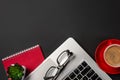 High angle view of businessman desk with organizer, pen, glasses and laptop. Top view of office supplies on blackboard background Royalty Free Stock Photo