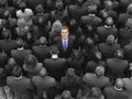 High angle view of a businessman standing amidst businesspeople