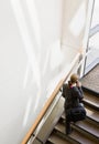 High angle view of businesswoman ascending stairs Royalty Free Stock Photo