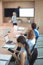 High angle view of businesswoman using digital tablet while sitting during meeting Royalty Free Stock Photo