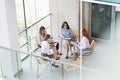 High angle view of businesswomen discussing in office Royalty Free Stock Photo