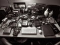 Table with laptops smartphones and office supplies