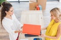 high angle view of cashier giving shoe boxes