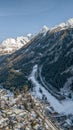 Aerial drone view of Chamonix city at the foot of snow covered Alps mountain brevent Royalty Free Stock Photo