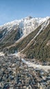Aerial drone view of Chamonix city at the foot of snow covered Alps mountain brevent Royalty Free Stock Photo