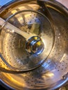 High angle view of a chrome pasta strainer in a pot on a stove Royalty Free Stock Photo