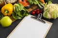 high angle view clipboard with vegetables. High quality photo