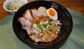 High angle view, close up egg noodle with pork meat ball Thai style in black bowl, delicious, signature, local food,