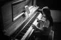 High angle view of concentrated girl practicing piano