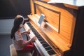 High angle view of concentrated girl practicing piano